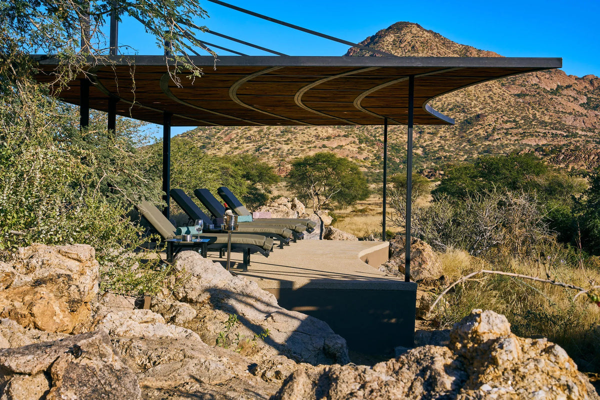 Pool-Loungers-Hohenstein-Lodge at Hohenstein Lodge, Erongo Mountains, Namibia.