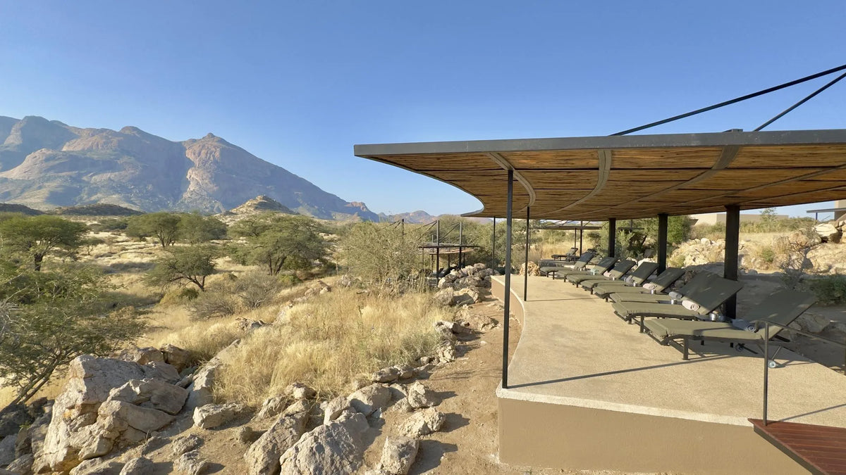 Pool-Loungers-Hohenstein-Lodge at Hohenstein Lodge, Erongo Mountains, Namibia.