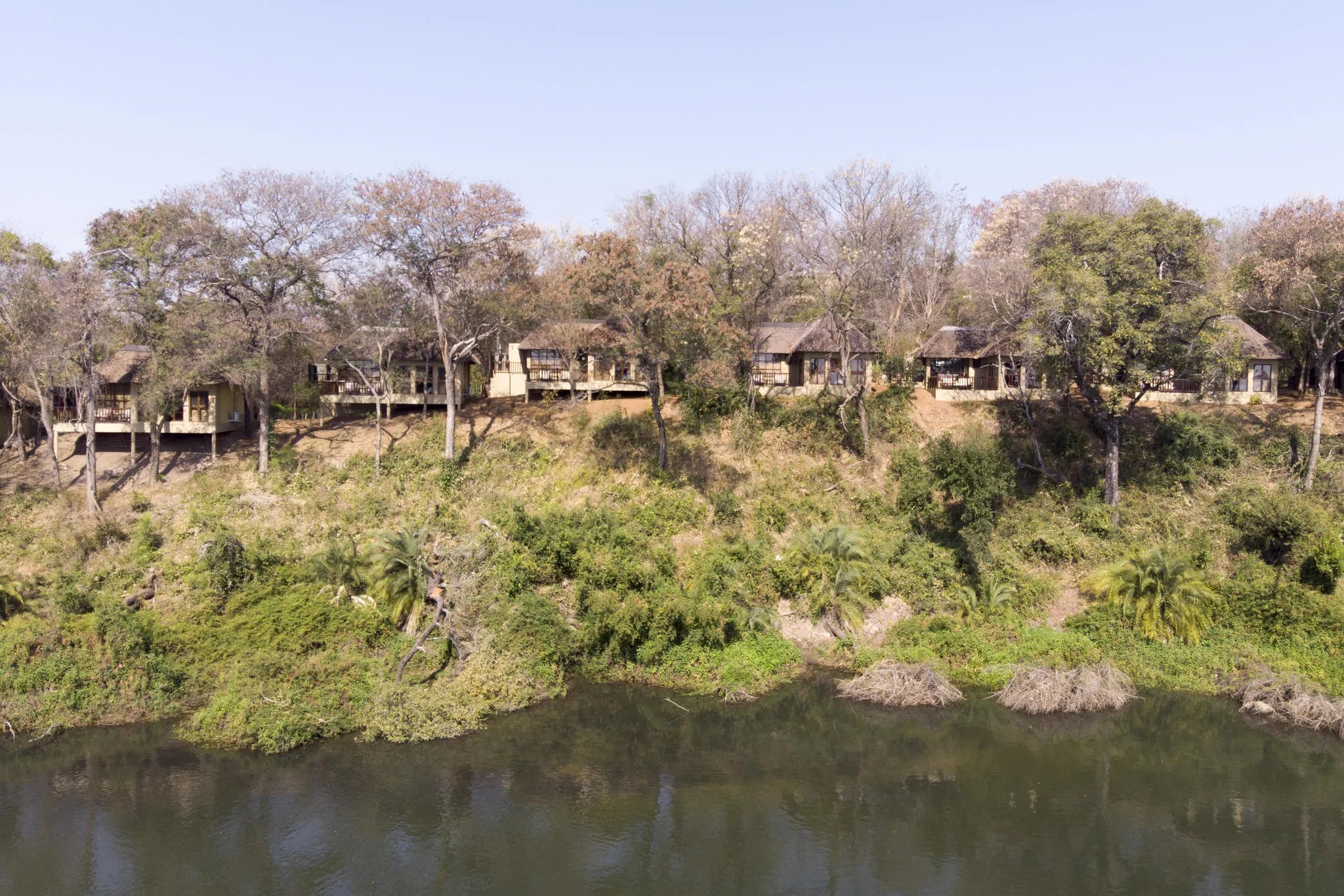 Room view from the water at Divava Okavango Resort & Spa, Divundu, Namibia.