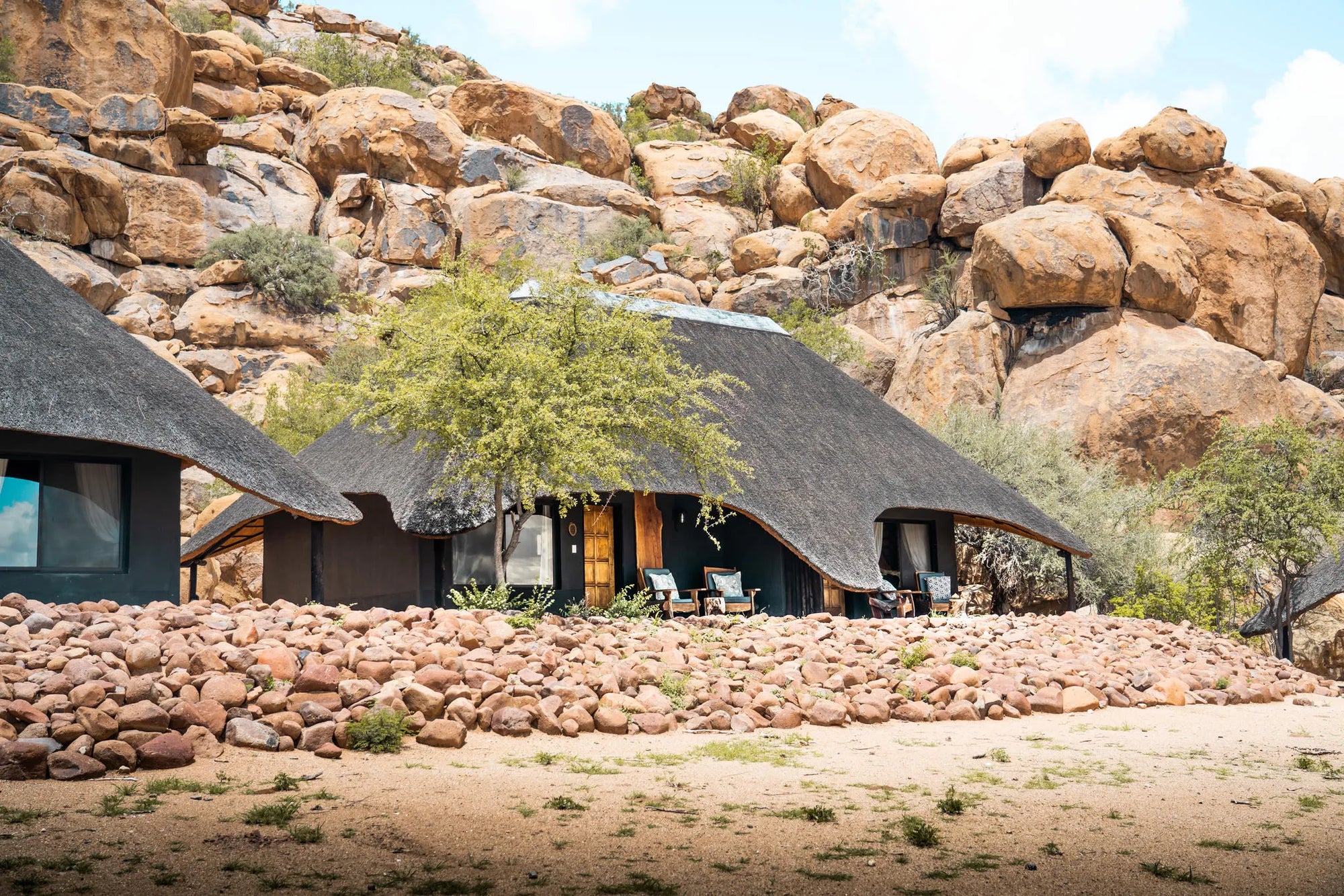 Thatched Chalets at Ai Aiba Rock Painting Lodge, Erongo Mountains, Namibia.