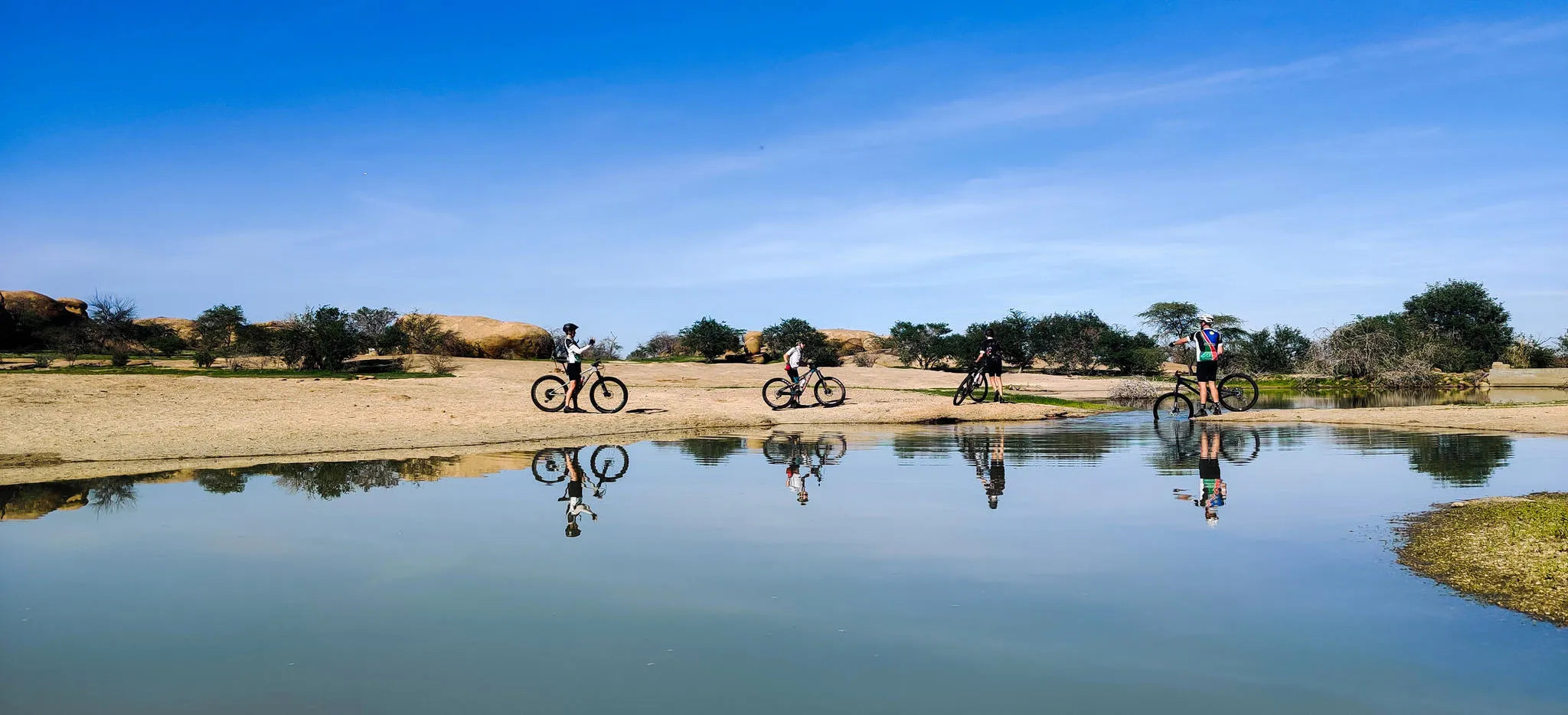 Cycling at Ai Aiba (in rainy season) at Ai Aiba Rock Painting Lodge, Erongo Mountains, Namibia.