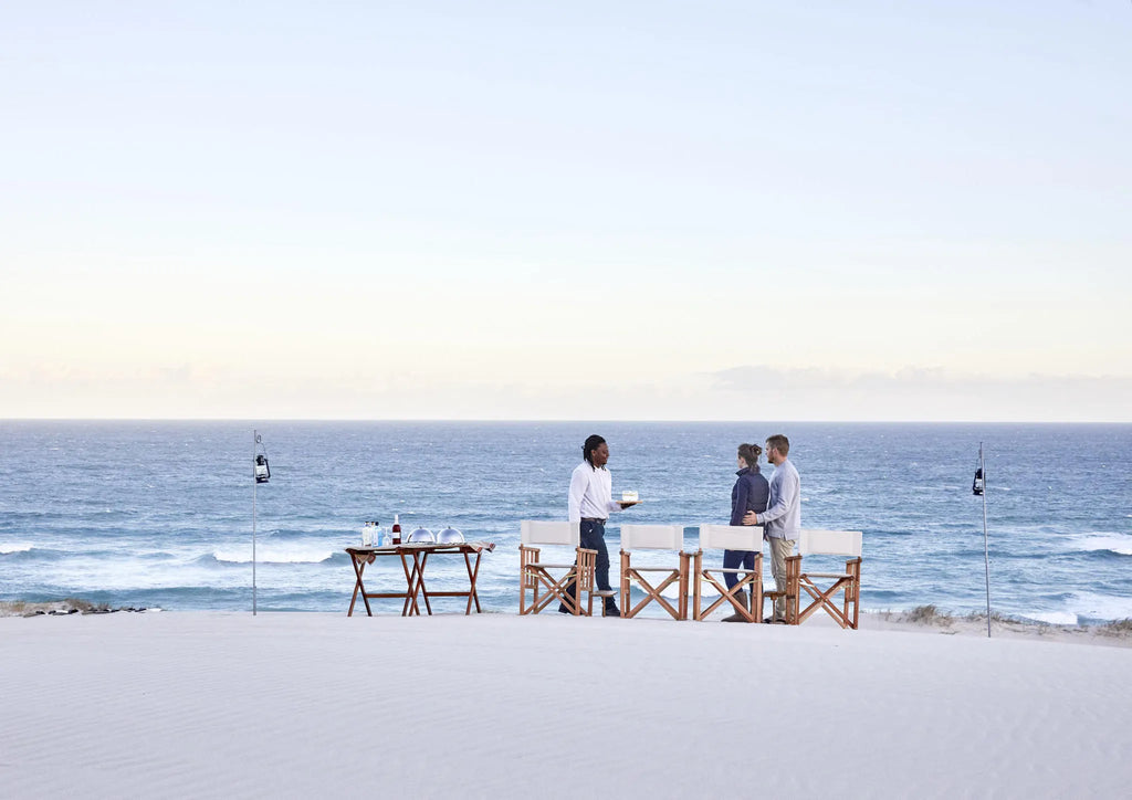 Morukuru Beach Lodge - Sundowners in the sand dunes at Morukuru Beach Lodge, De Hoop Nature Reserve, South Africa.