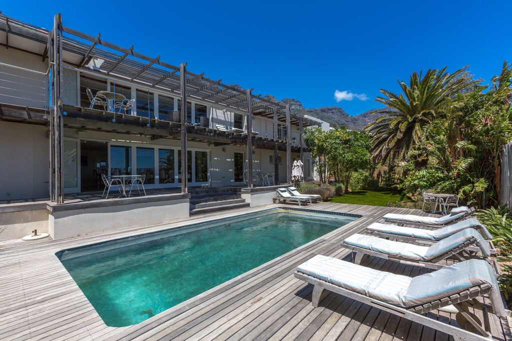 Swimming pool with sun loungers