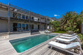 Swimming pool with sun loungers