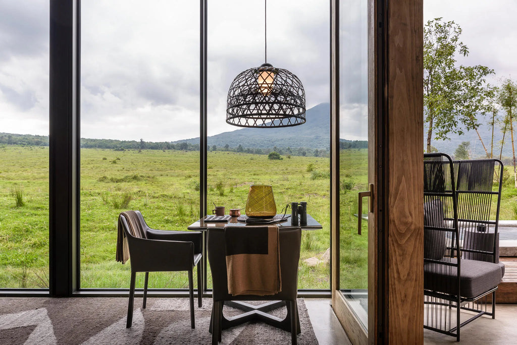 Singita Kwitonda Lodge - Dining with a View at Singita Kwitonda Lodge, Volcanoes National Park, Rwanda.
