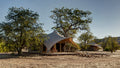 Canvas covered tents for guests.