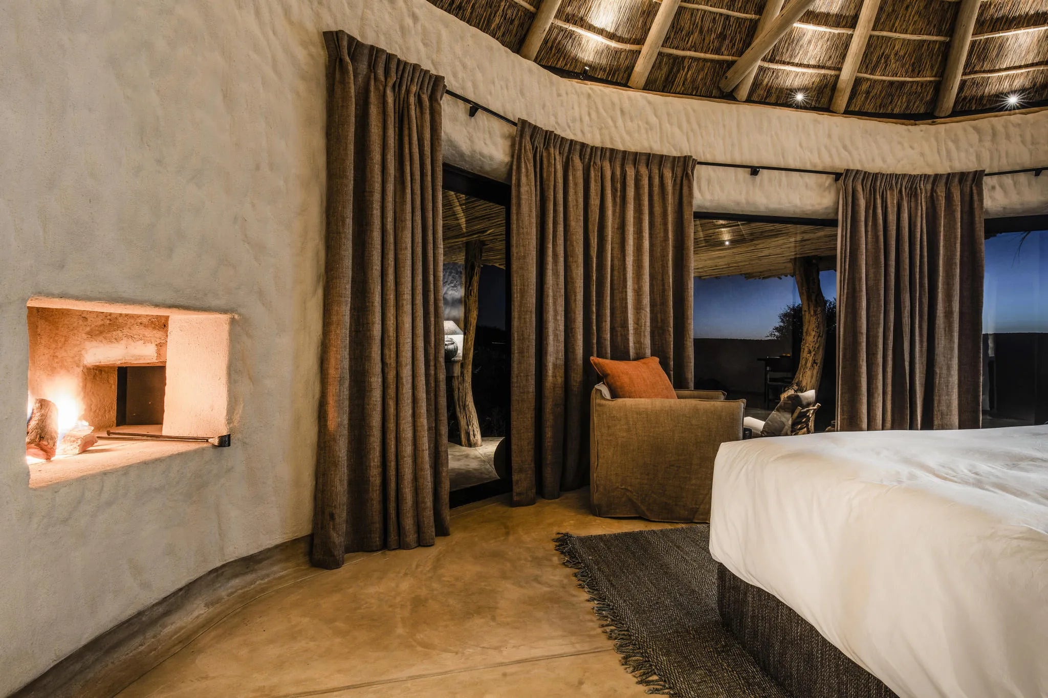 Bedroom with fireplace at Zannier Omaanda, Zannier Reserve, Namibia.