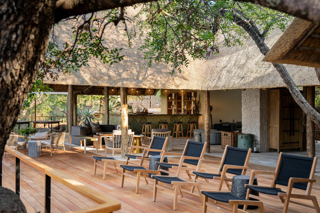 Deck seating overlooking riverbed at Thornybush Game Lodge, Thornybush Game Reserve, South Africa.