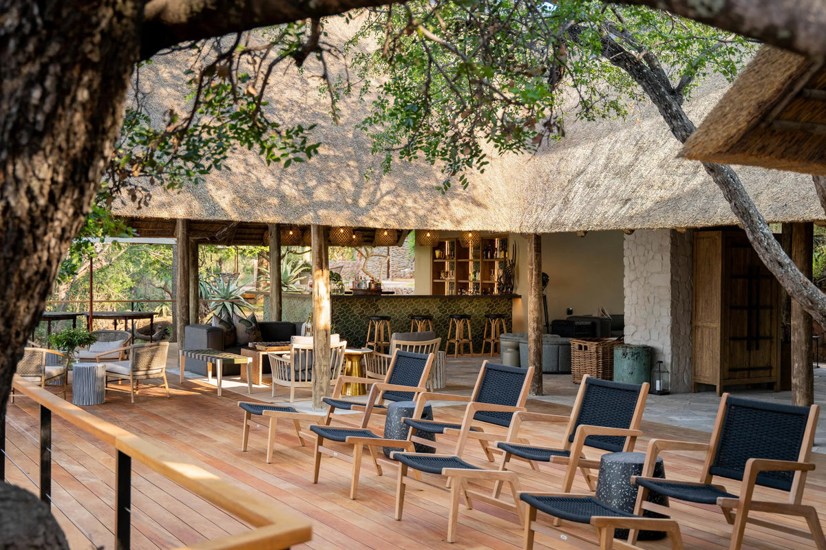 Deck seating overlooking riverbed at Thornybush Game Lodge, Thornybush Game Reserve, South Africa.