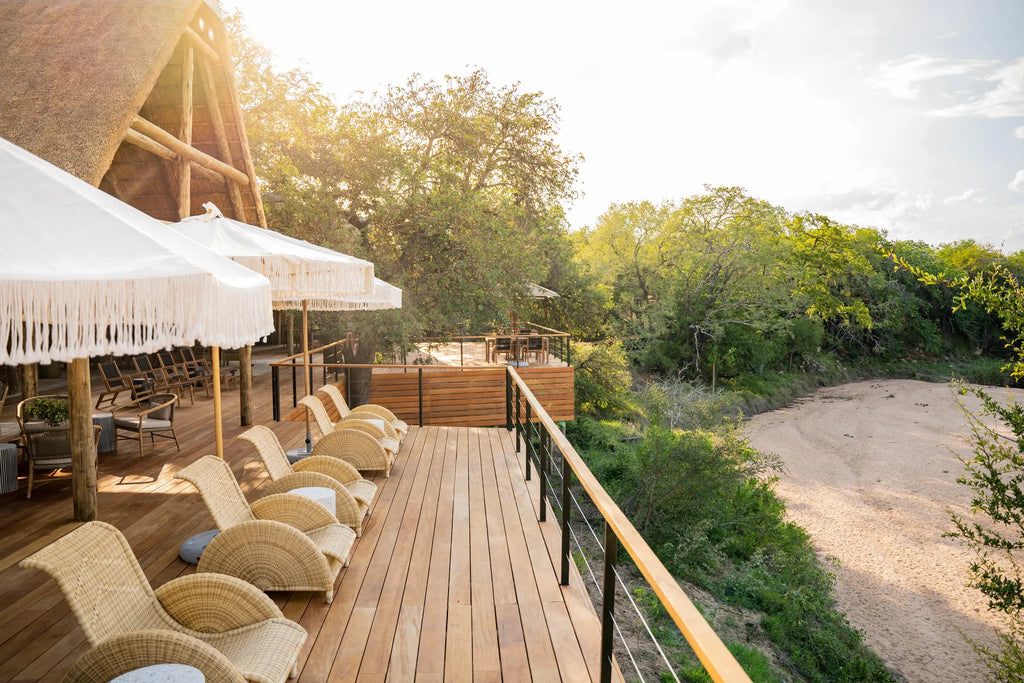 Deck seating overlooking riverbed at Thornybush Game Lodge, Thornybush Game Reserve, South Africa.
