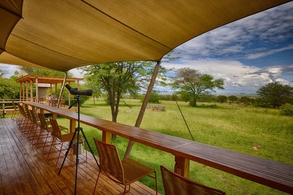 Sayari -deck with viewing area and scope to search for wildlife in the wilderness beyond at Sayari, Northern Serengeti, Ta...