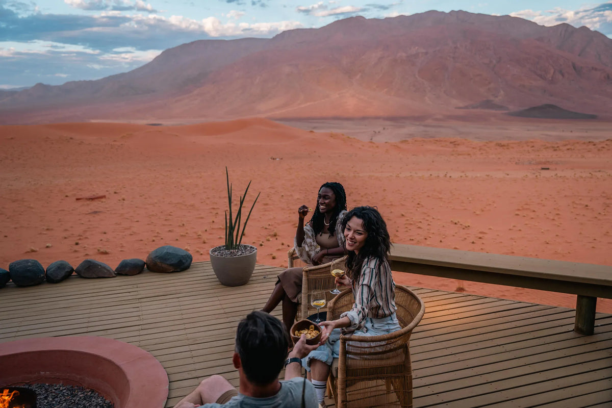 Swapping Stories by the Fire at Wolwedans Desert Lodge, NamibRand Nature Reserve, Namibia.