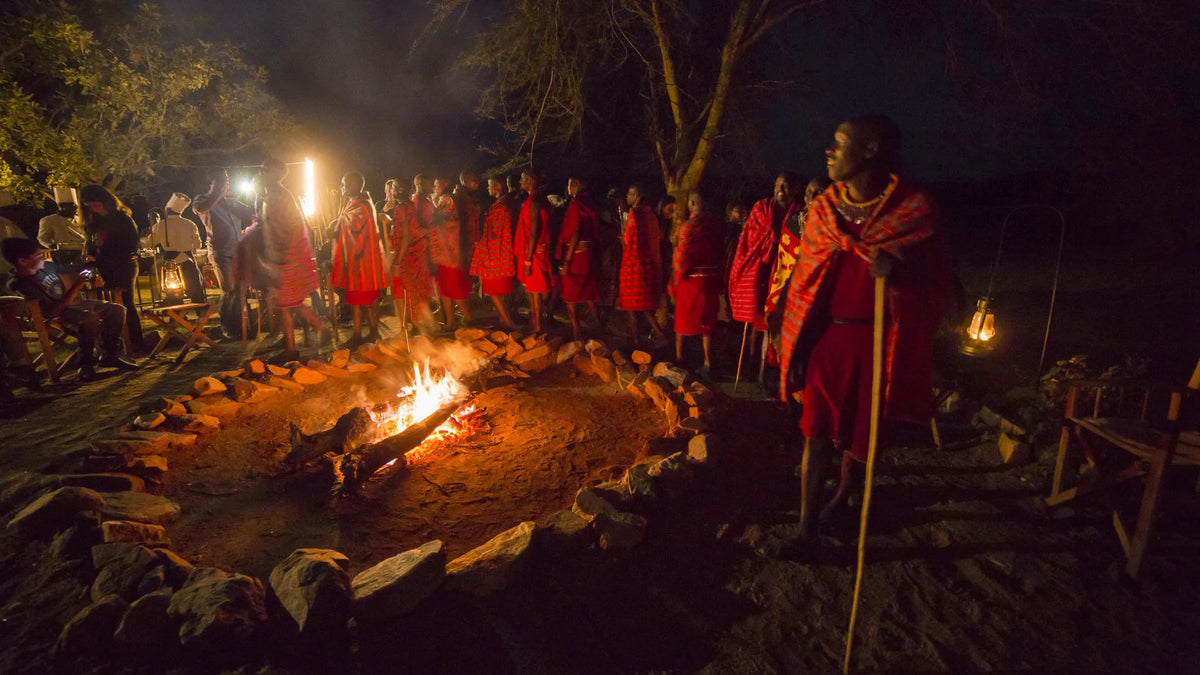Drinks around the camp fire with traditional Masai dancing