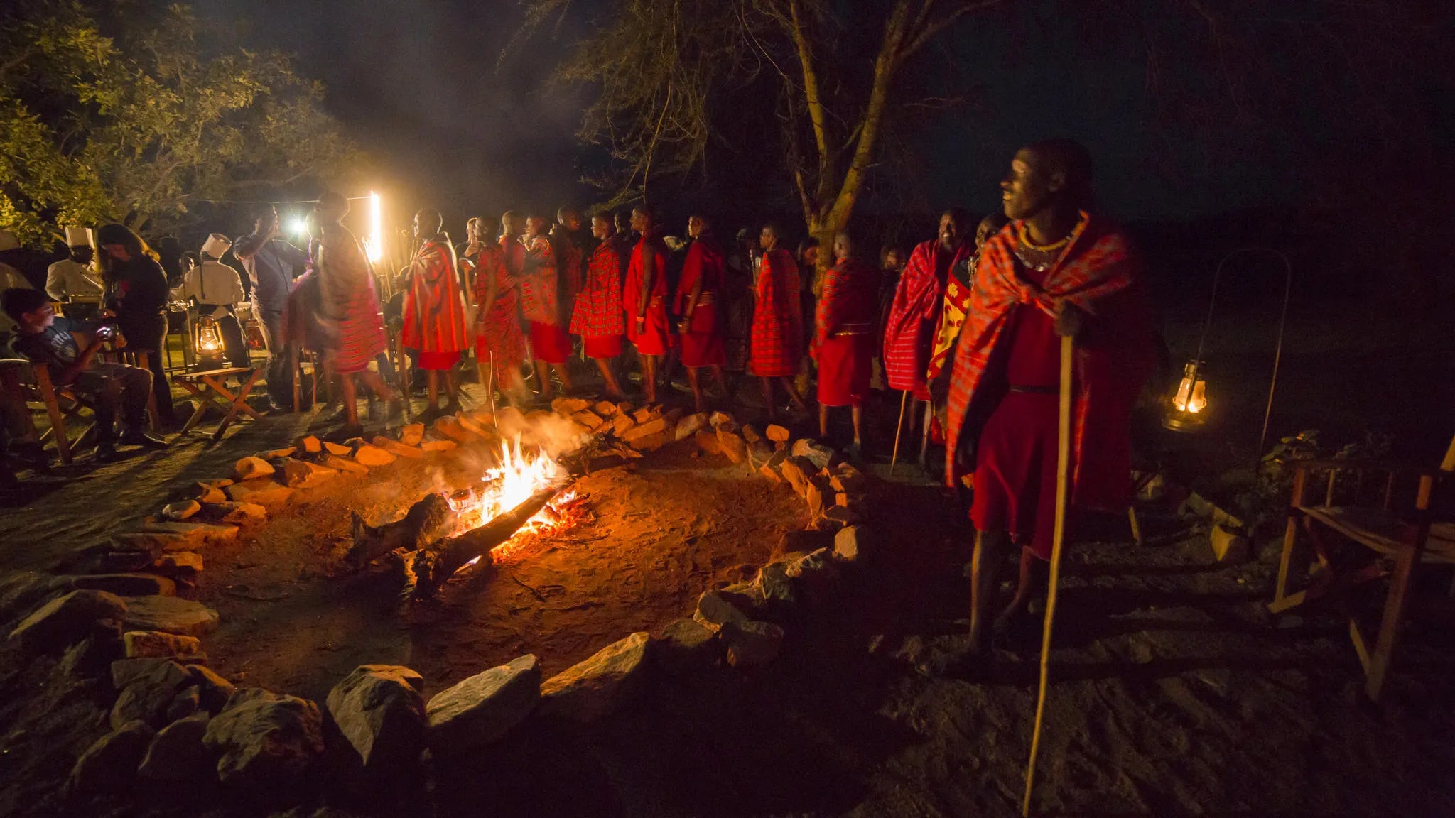 Drinks around the camp fire with traditional Masai dancing