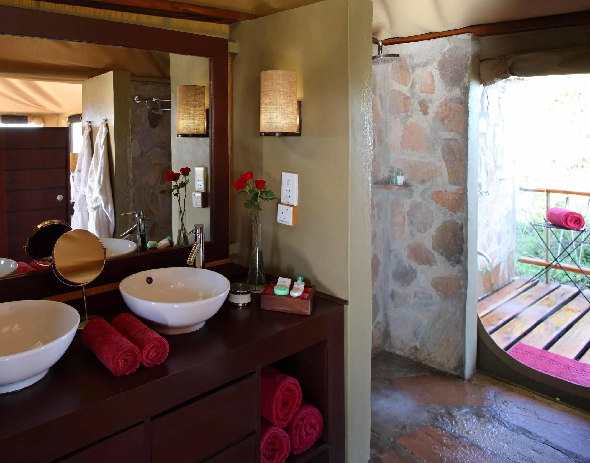 bathrooms with inside- and outside rain showers at Mara Bushtops Camp, Masai Mara, Kenya.