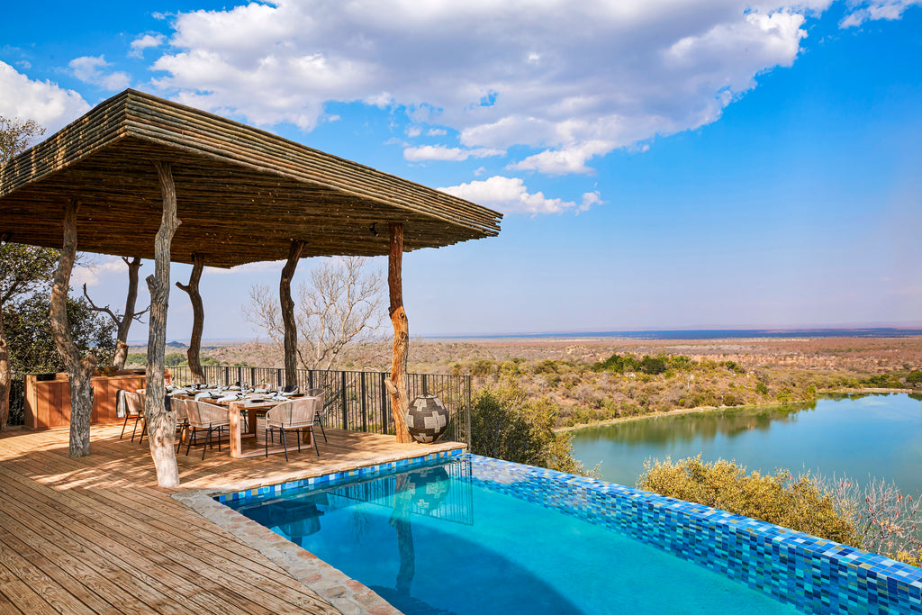 Singita Malilangwe House - Family dining and pool with a view