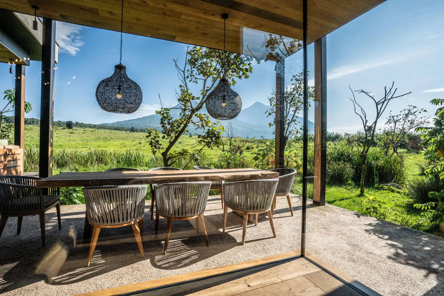 Singita Volcanoes National Park - Outdoor Dining at Singita Kataza House, Volcanoes National Park, Rwanda.