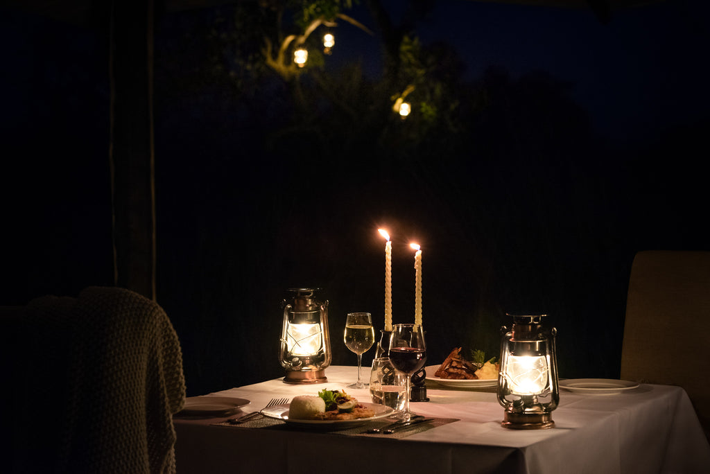 Romantic candlelit dinner in private dining tent