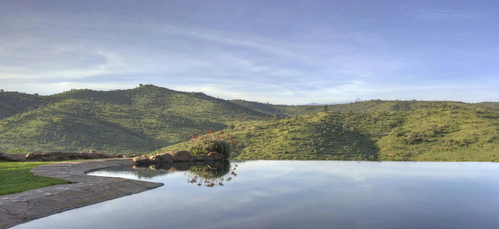 The Borana Lodge pool with Mt Kenya in the distance at Borana Lodge, Borana Conservancy, Kenya.