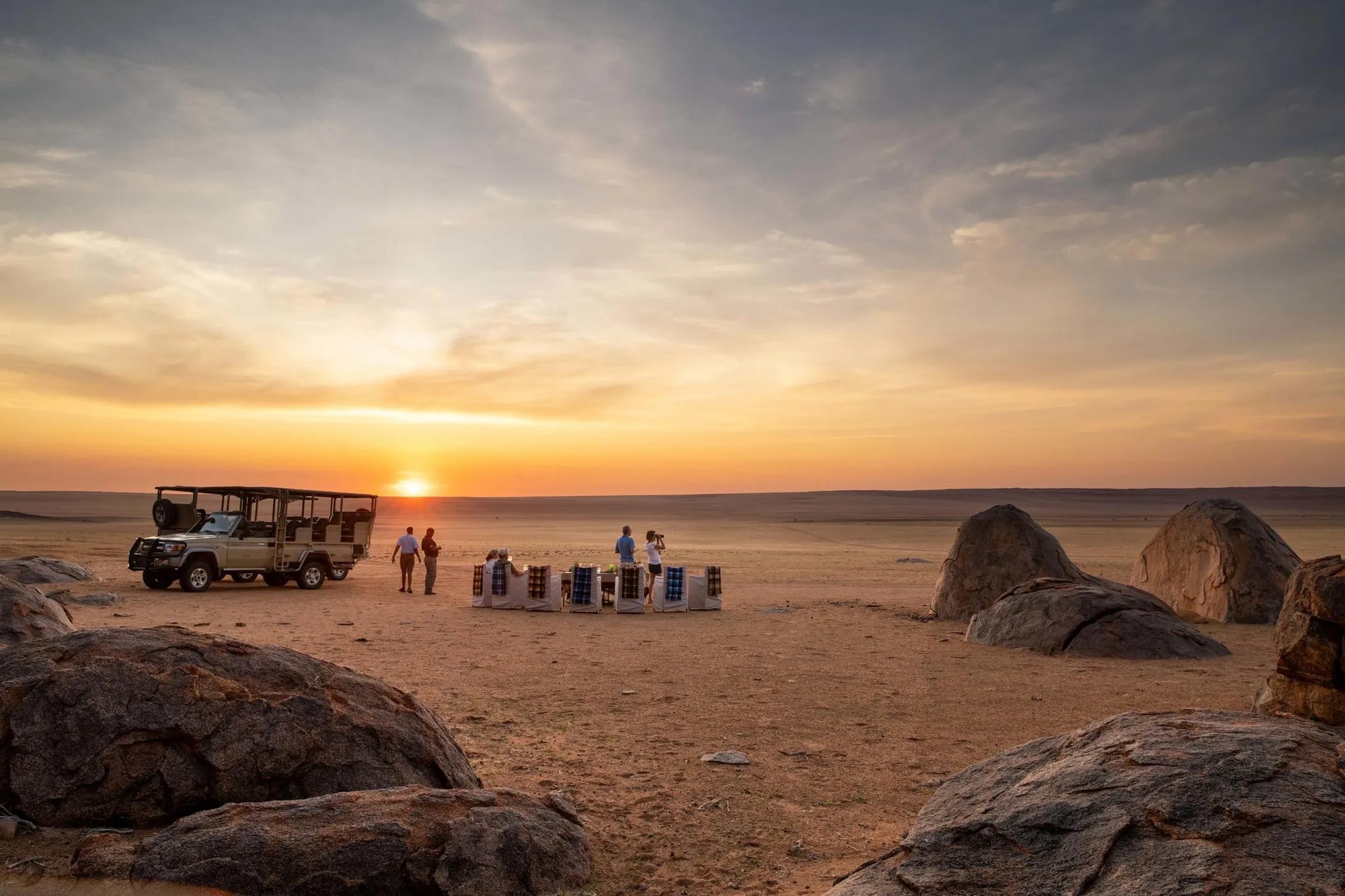 Sundowners at Kwessi Dunes, NamibRand Nature Reserve, Namibia.