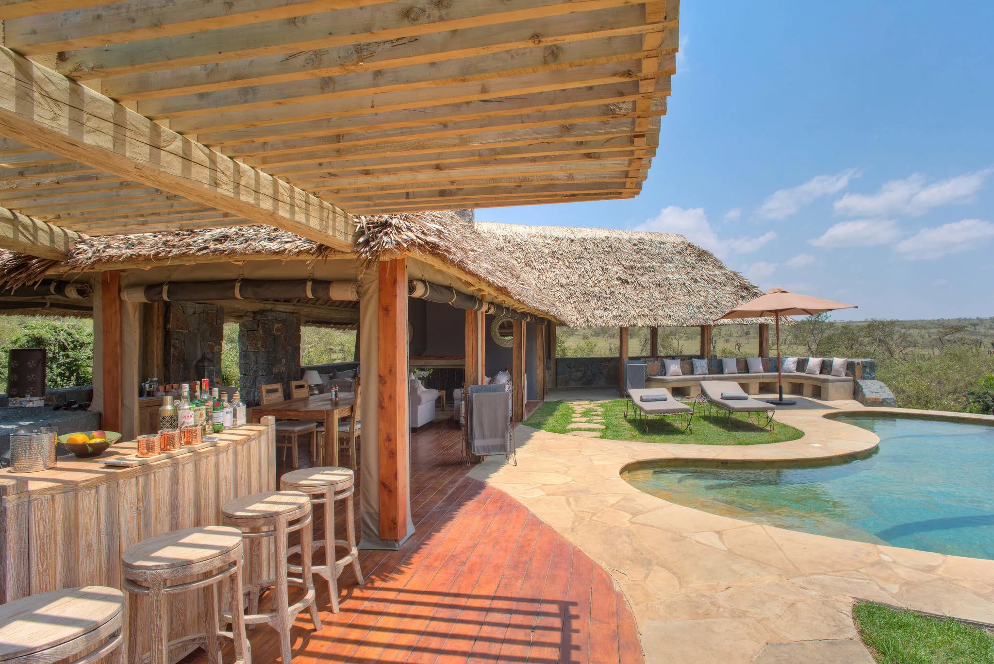 Naboisho Camp - Bar and pool area at Naboisho, Mara Naboisho Conservancy, Kenya.