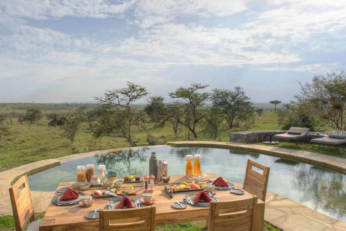 Naboisho Camp - Lunch setup at the pool at Naboisho, Mara Naboisho Conservancy, Kenya.