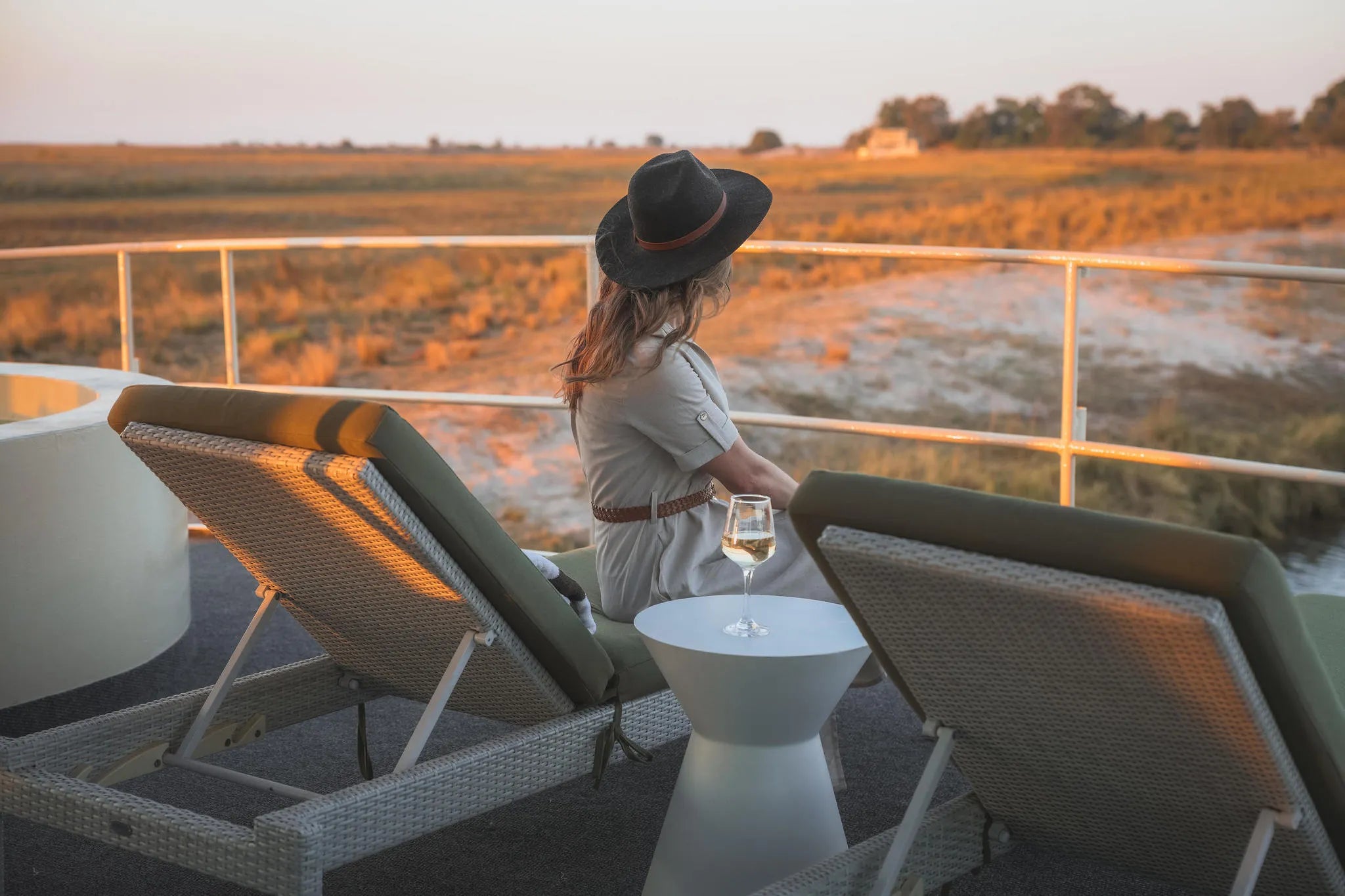Chobe Princess Guest relaxing on sun loungers at Chobe Princess By Mantis, Chobe River Front Namibia, Namibia.