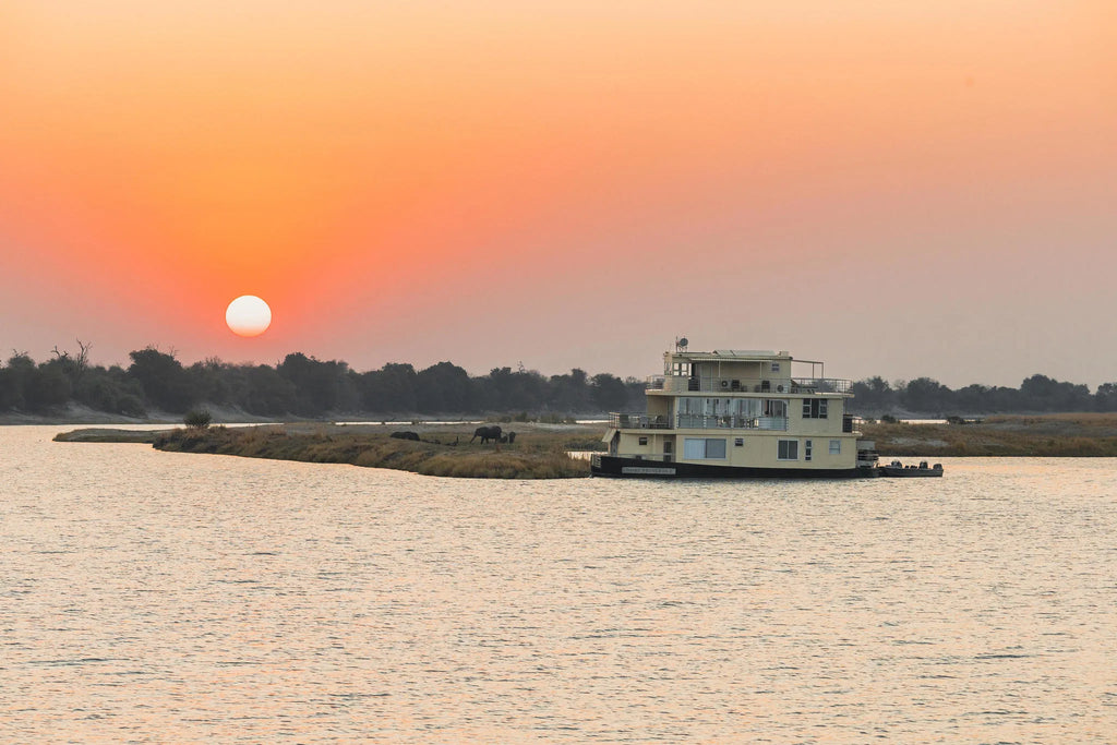 Chobe Princess with Elephant in distance at Chobe Princess By Mantis, Chobe River Front Namibia, Namibia.