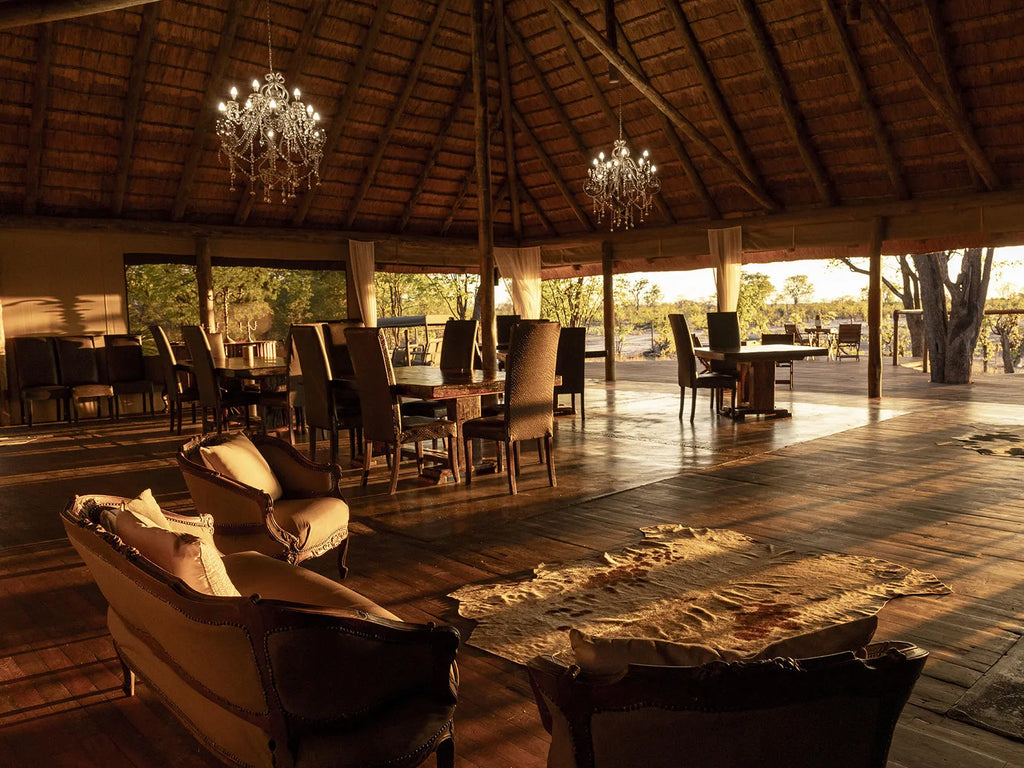 Indoor dining and lounge area at Hideaways Camp Kuzuma, Chobe, Kazuma Forest Reserve, Botswana.