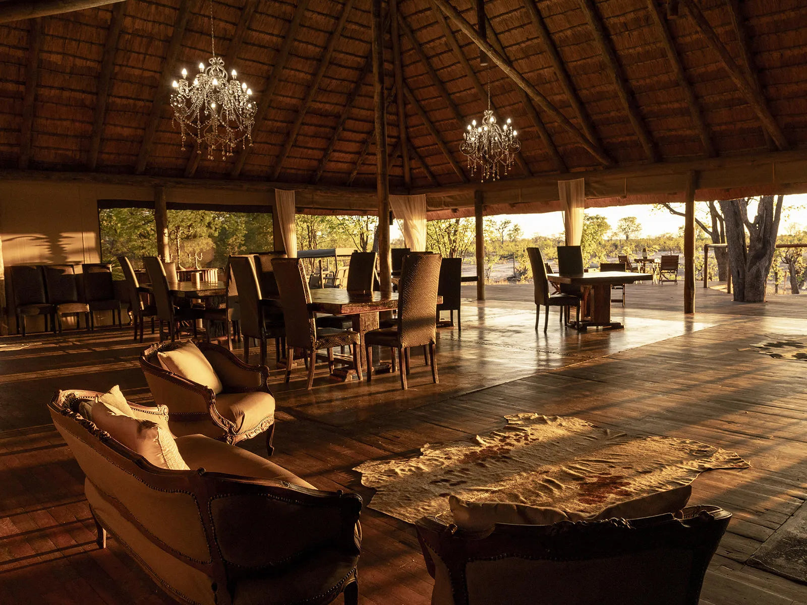 Indoor dining and lounge area at Hideaways Camp Kuzuma, Chobe, Kazuma Forest Reserve, Botswana.
