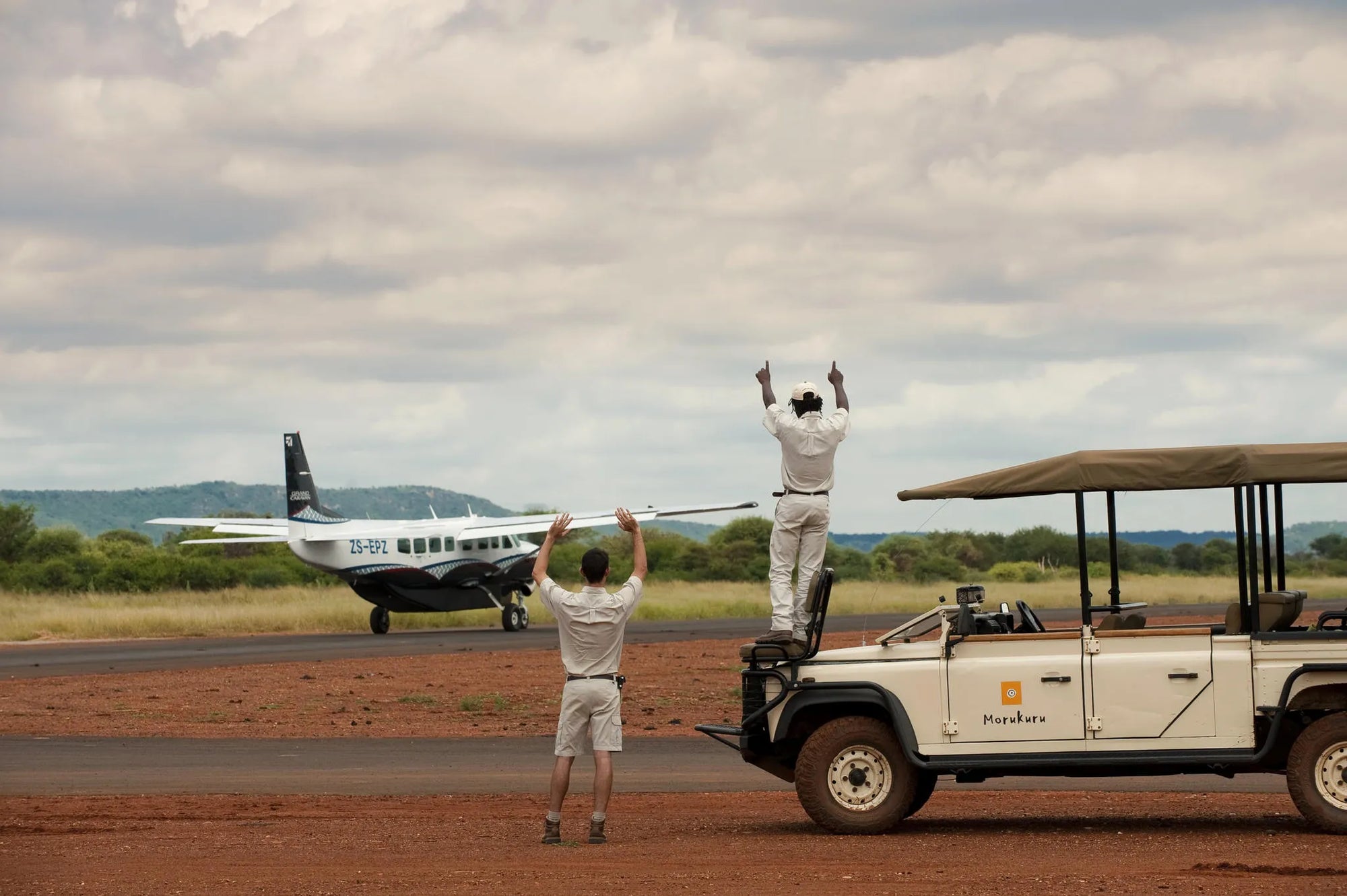 Morukuru Family Madikwe - waving our guests goodbye at Madikwe East airstrip at Morukuru Farm House, Madikwe Game Reserve,...
