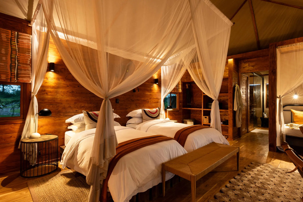 Asilia Africa - Sayari Retreat - Twin Room Interior Evening at Retreats at Sayari, Northern Serengeti, Tanzania.