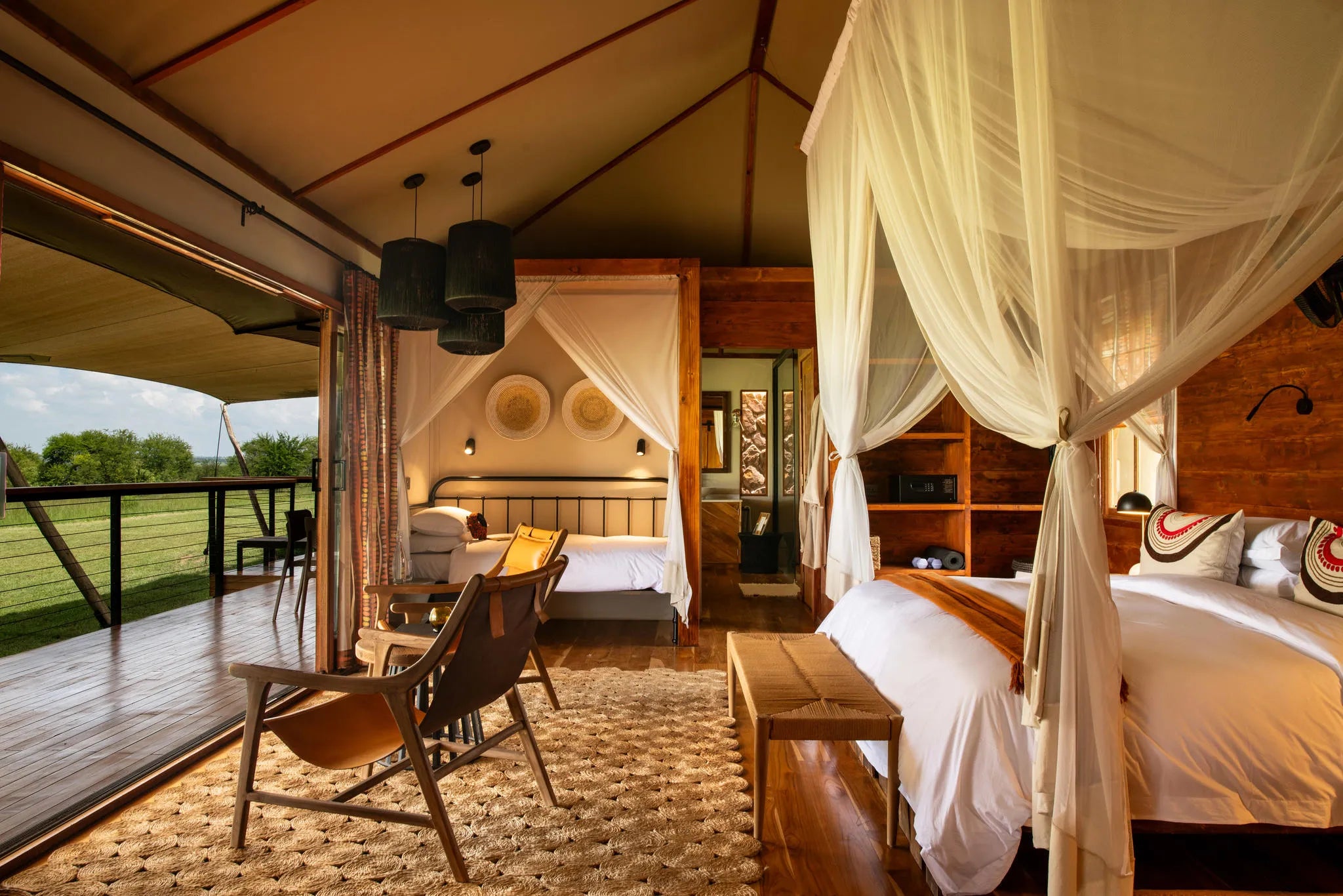 Asilia Africa - Sayari Retreat - Bedroom with extra Twin Bed set up at Retreats at Sayari, Northern Serengeti, Tanzania.