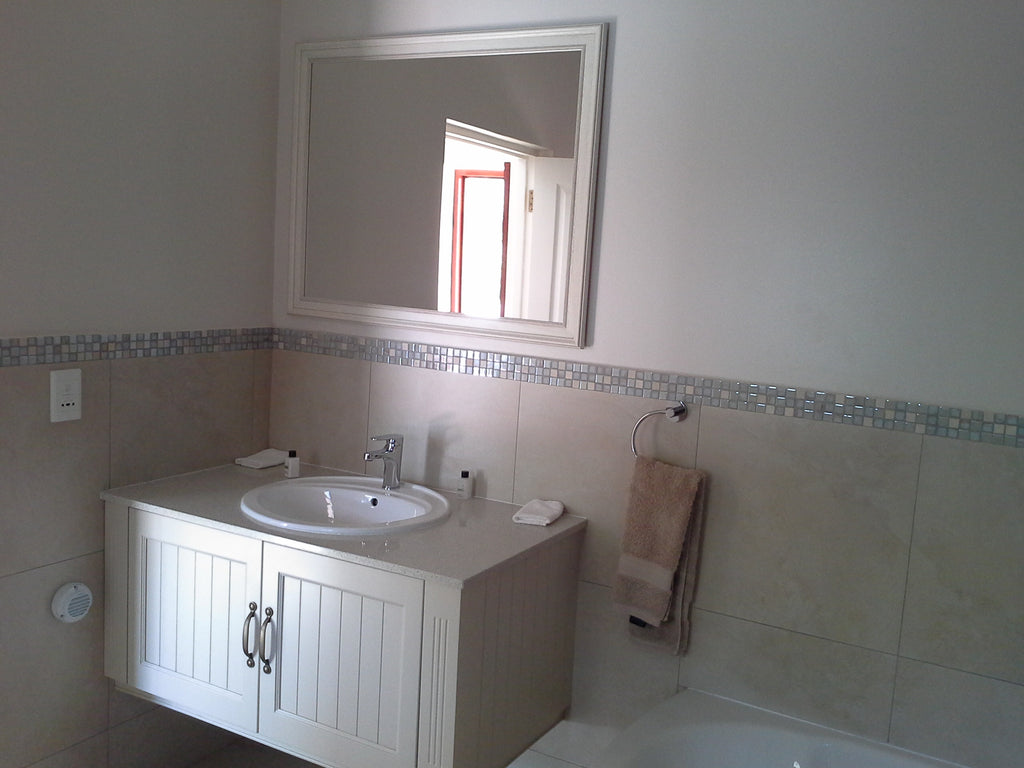 Spacious modern bathroom with large shower.