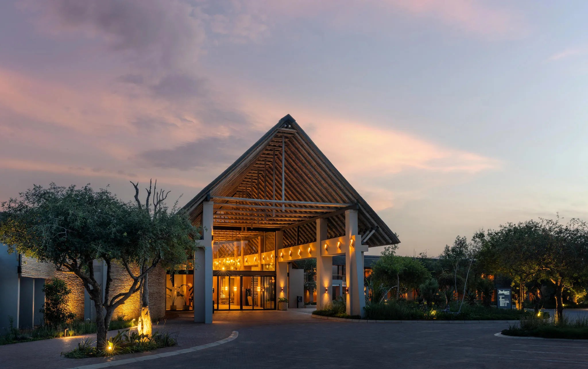 Hotel Entrance at Night at Radisson Safari Hotel Hoedspruit, Hoedspruit, South Africa.