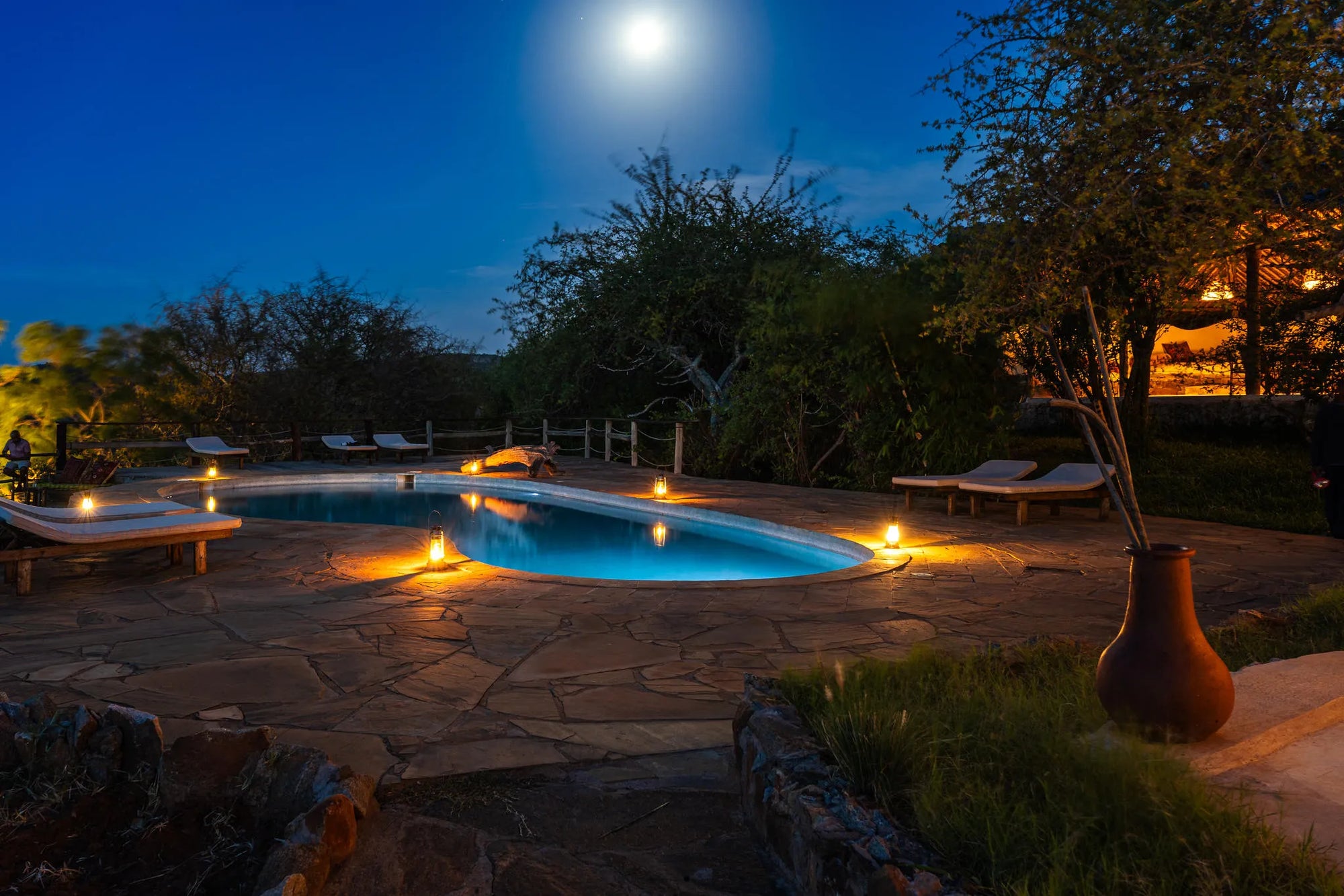 Kipalo Hills, mess area and pool by night at Kipalo Hills, Tsavo West National Park, Kenya.