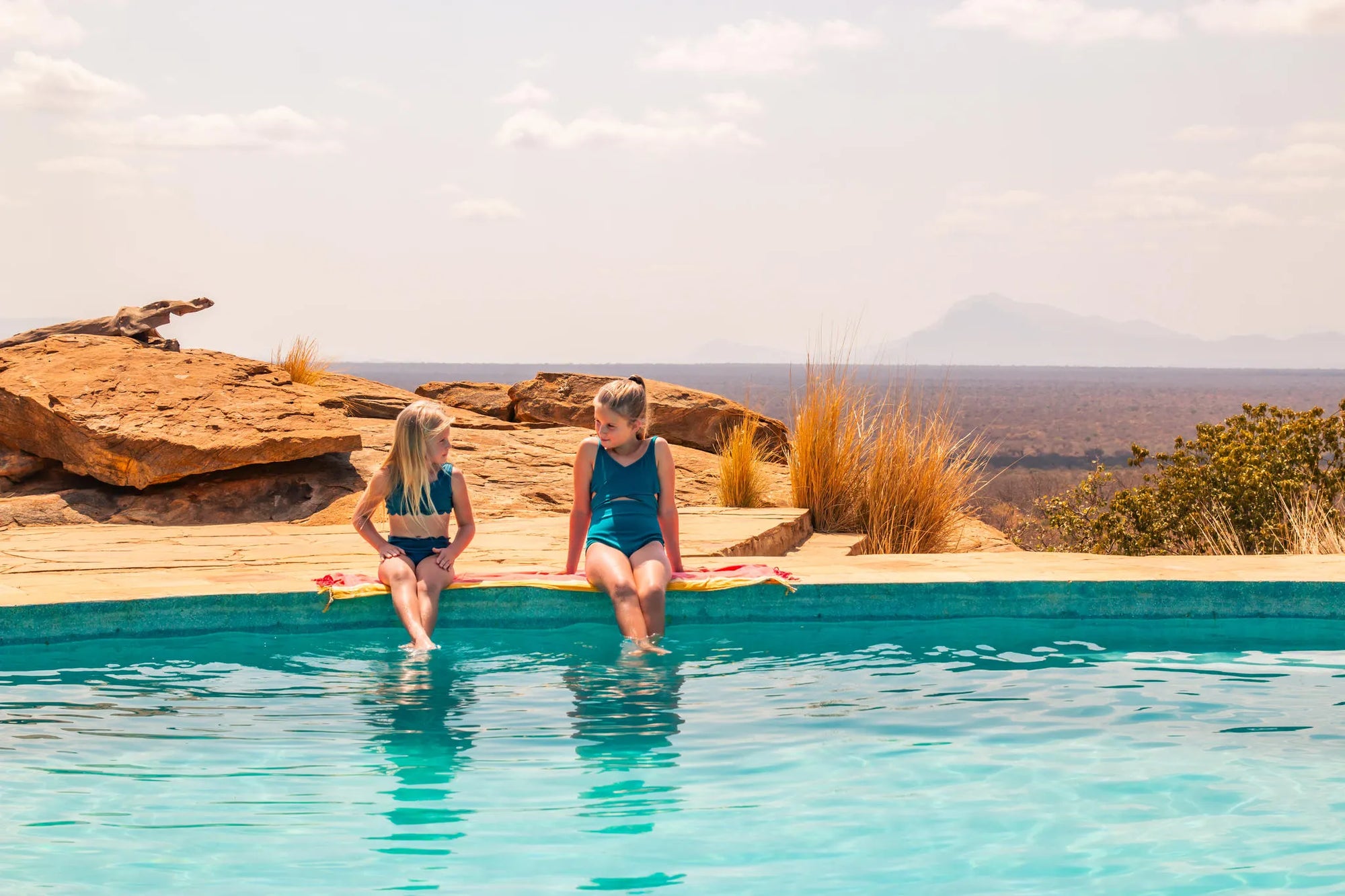 Kipalo Hills, pool, kids at Kipalo Hills, Tsavo West National Park, Kenya.