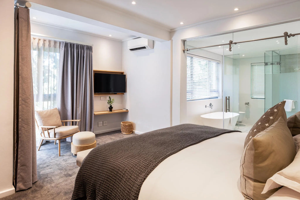 Deluxe River Apartment Bedroom at Vineyard Hotel, Cape Town, South Africa.