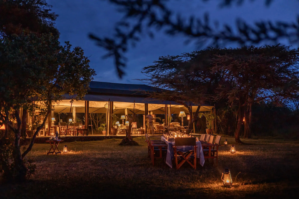 Outdoor Dinner Setup at Hemingways River Camp Mara, Mara North Conservancy, Kenya.