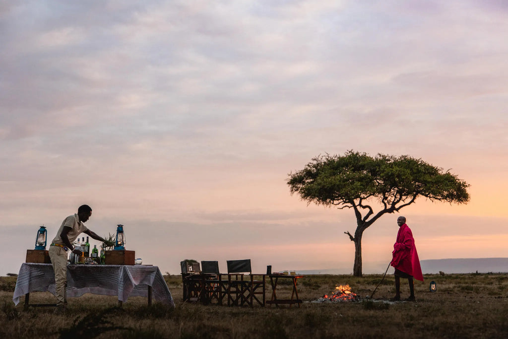 Sundowner in the plains at Hemingways River Camp Mara, Mara North Conservancy, Kenya.