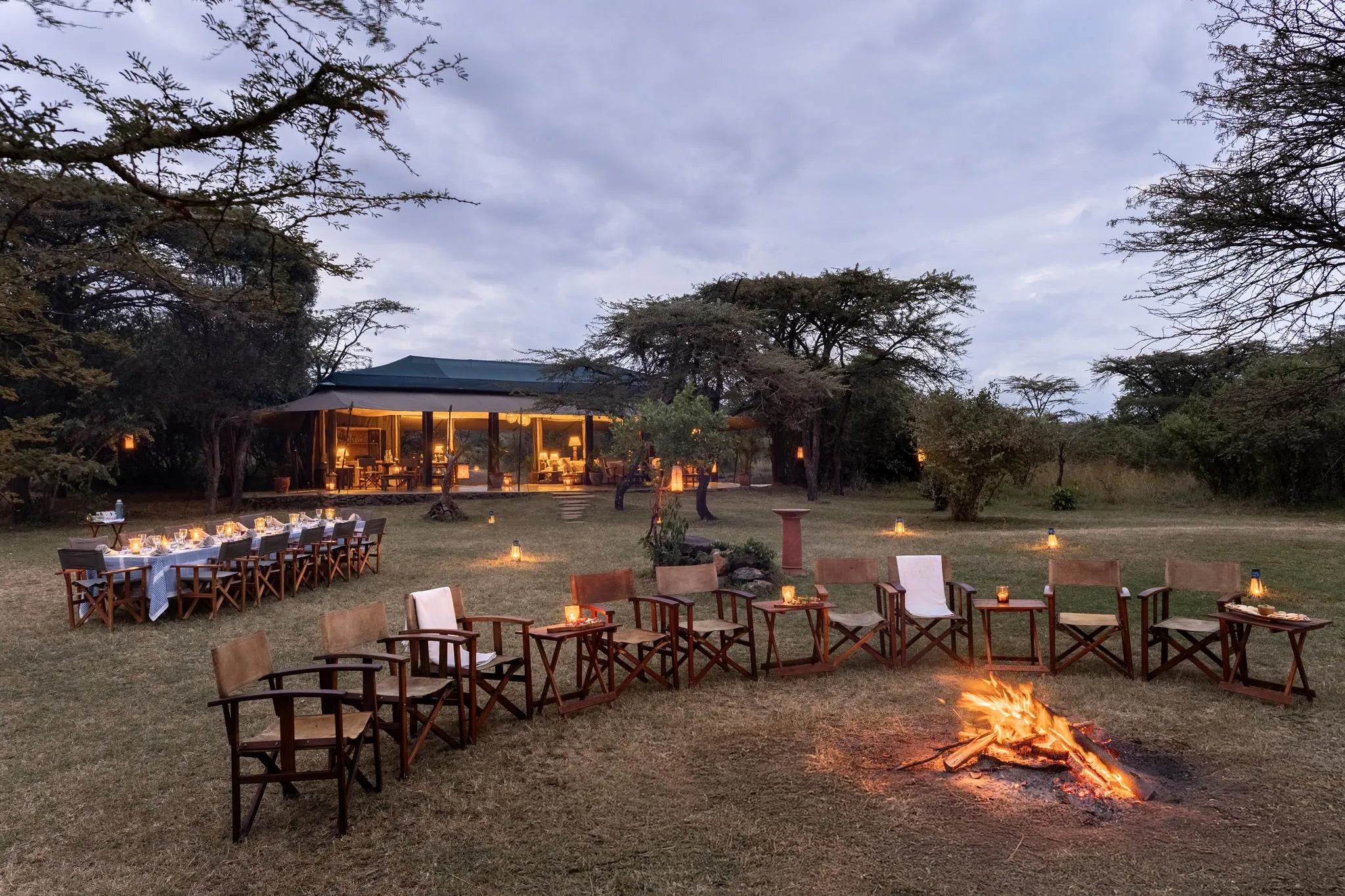 Sundowner at the camp at Hemingways River Camp Mara, Mara North Conservancy, Kenya.
