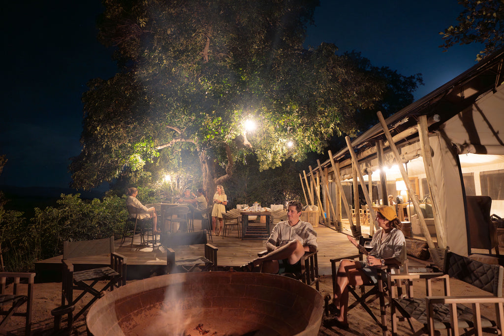 Little Mana Sands Main Area Fire Pit and Deck by Night