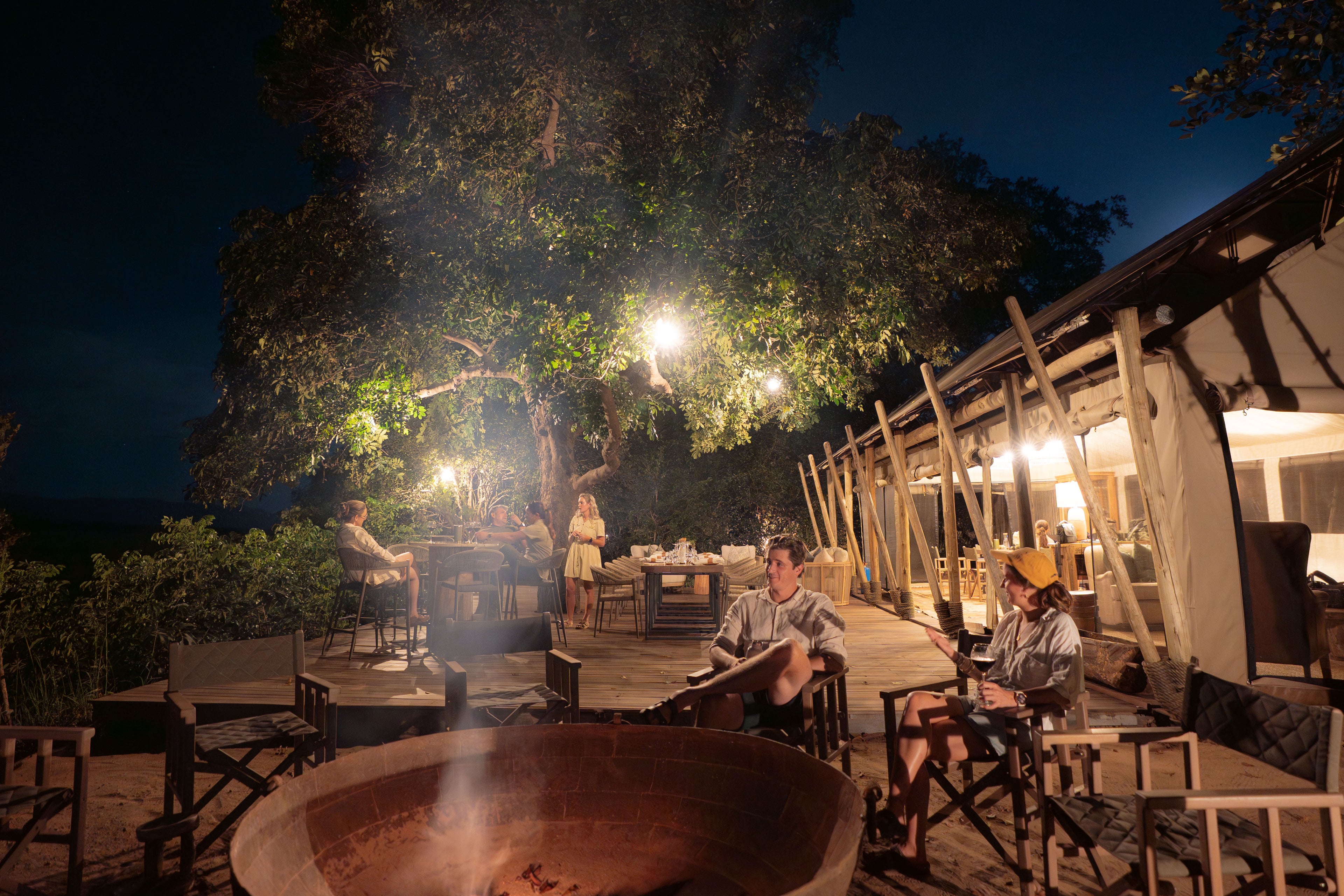 Little Mana Sands Main Area Fire Pit and Deck by Night