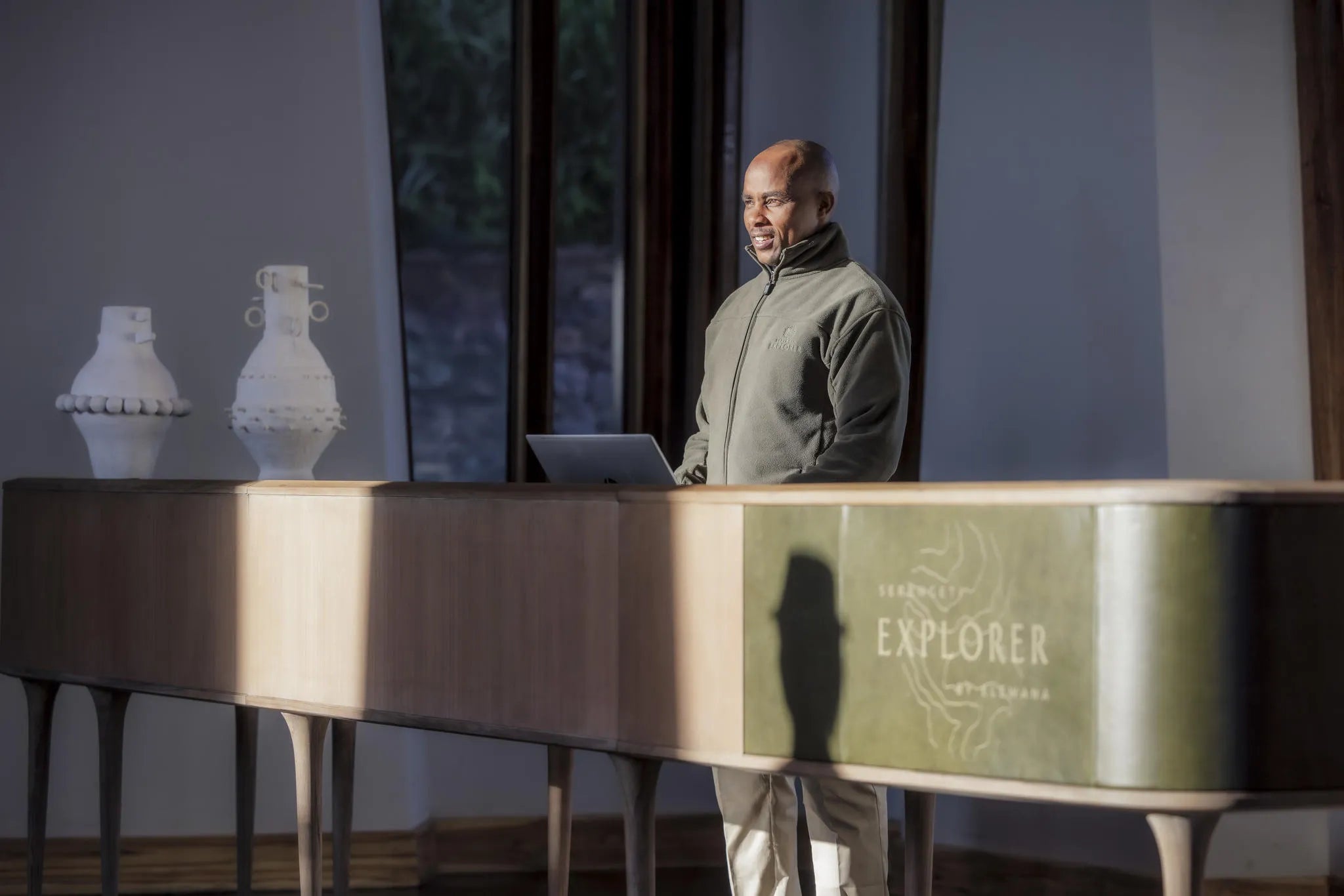 Receptionist Awaiting Guest at Serengeti Explorer by Elewana Collection, Seronera, Tanzania.