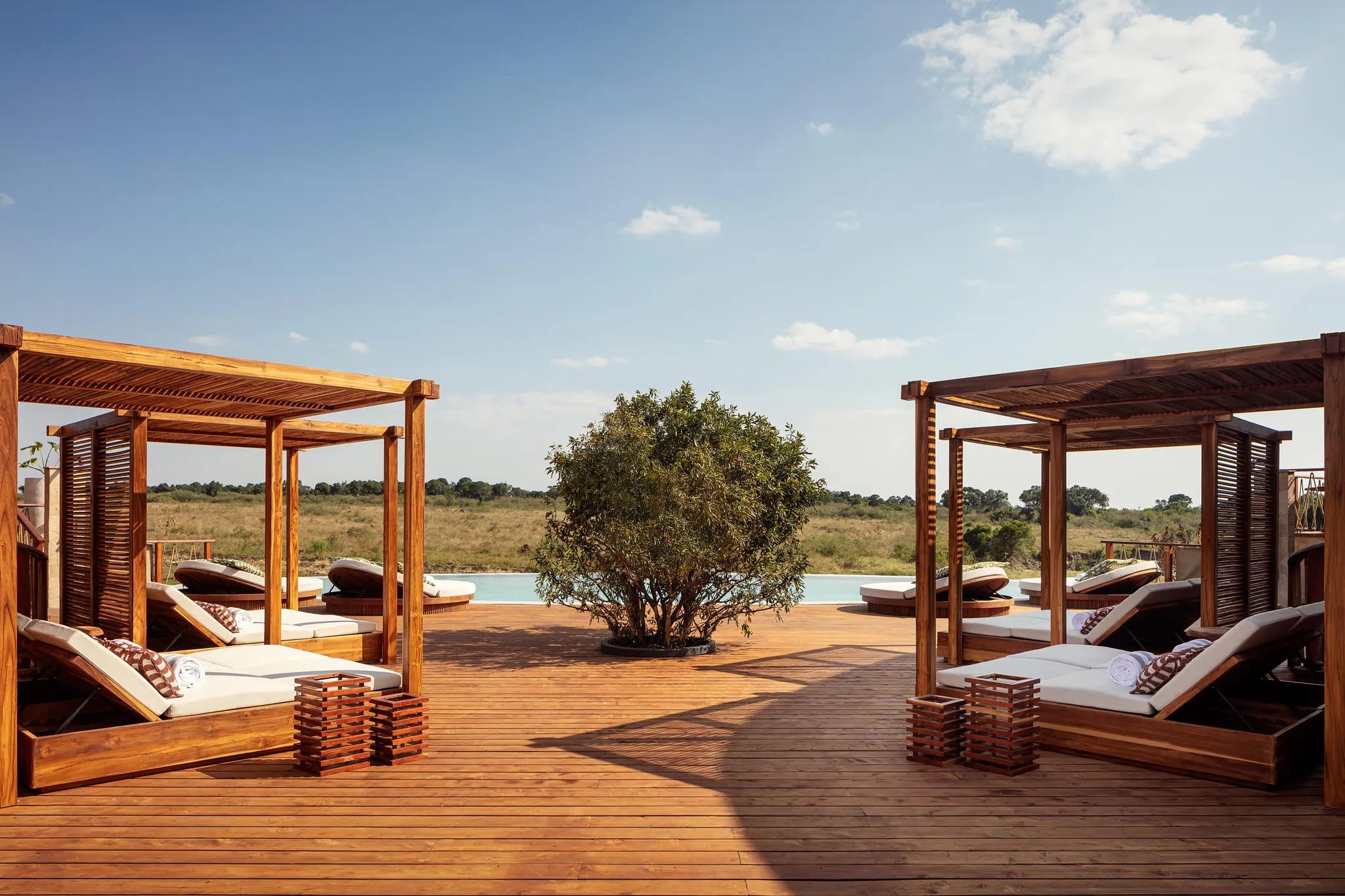 Swimming Pool Deck at The Ritz-Carlton, Masai Mara Safari Camp, Masai Mara National Reserve, Kenya.