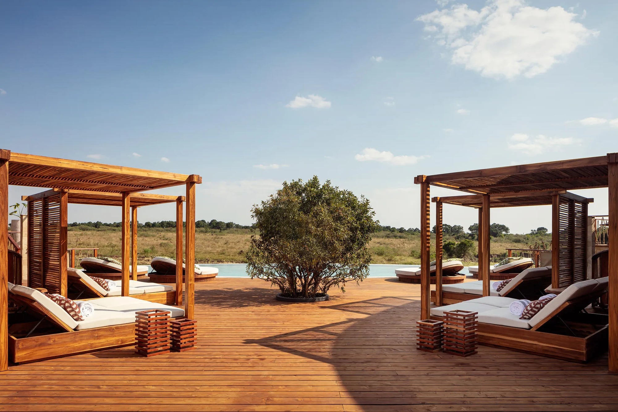 Swimming Pool Deck at The Ritz-Carlton, Masai Mara Safari Camp, Masai Mara National Reserve, Kenya.