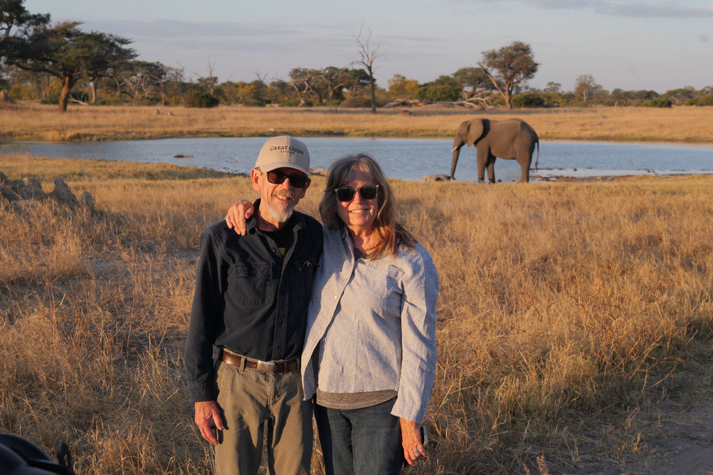 Guests on safari with elephant nearby