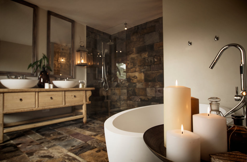 A luxurious en-suite bathroom with soaking tub and separate "rain" shower