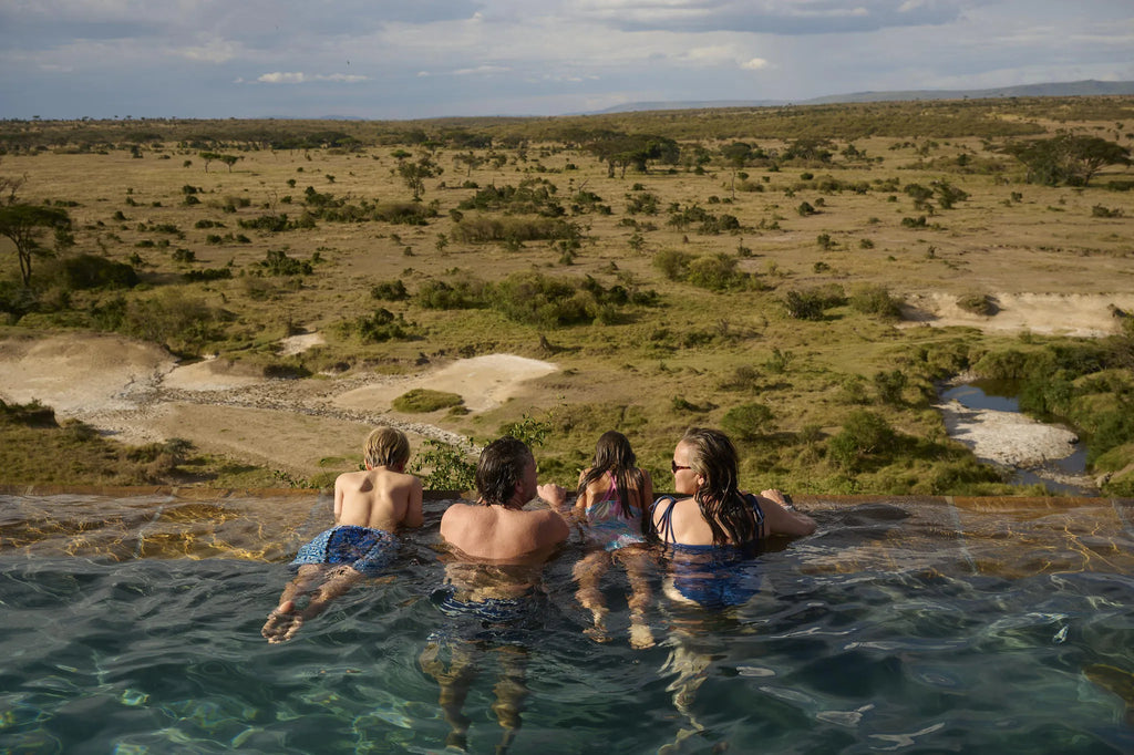 Family time by the pool at Saruni Eagle View, Mara Naboisho Conservancy, Kenya.