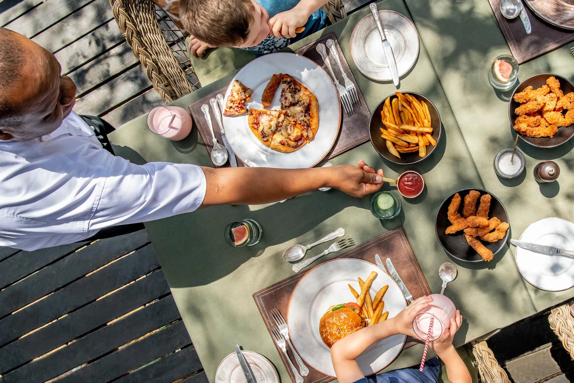 Family Lunch Outdoors at Singita Ebony Lodge, Sabi Sand Nature Reserve, South Africa.